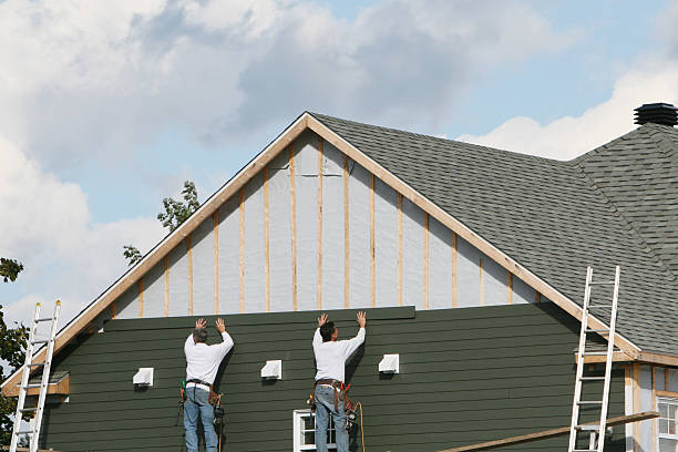 Professional Siding technician working in Concord, MA